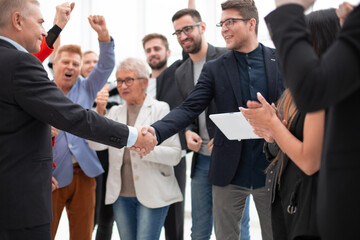 Businessteam is introducing a colleague to another businessman