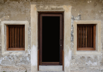 Old vintage traditional wooden window, door and cement wall