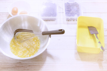 A girl making brownies. (Pastel color filter)
