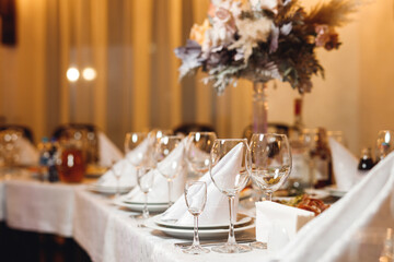 Wedding table setting with empty wine glasses