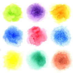 Nine watercolor painted in circle shape on a white rough watercolor paper. Nine colors isolated on white background.