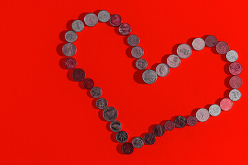 heart made of coins dollar euro ruble yuan franc yen pound zloty rupee