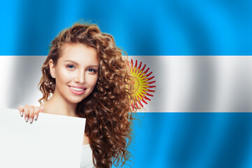 Portrait of happy woman student with white paper on the Argentina flag background. Travel and learn spanish language