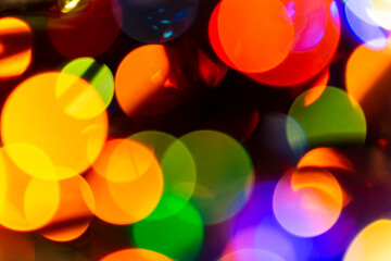 Multi-colored defocus Christmas lights. Close-up. Bokeh