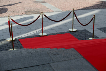 Elegant long red carpet on the wide steps of historic building