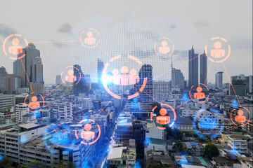 Multi exposure of Bangkok cityscape day time and social network hologram. Concept of media networking.