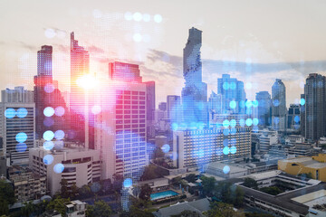 Fototapeta na wymiar Multi exposure of Bangkok cityscape sunrise background and world map hologram. Concept of media networking.