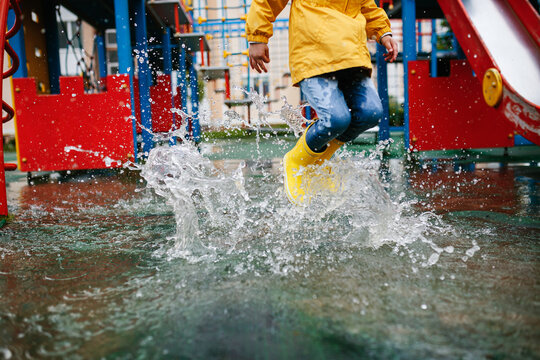 Unrecognizable Toddler Girl Child Wearing Yellow Rain Boots