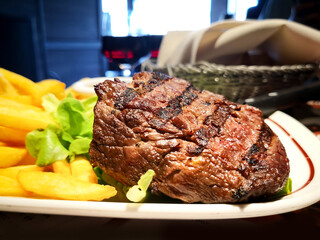 juicy steak beef meat with tomato and french fries