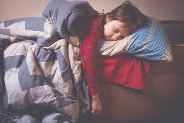 Llittle beautiful young girl sleeping in bed. Horizontal image.