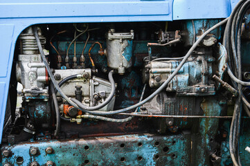 Engine of an old blue tractor. Texture. Background.