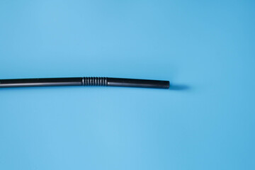 drinking straws on blue background