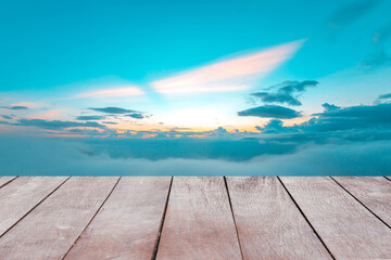 Wooden table top with clouds at sunset or evening time like heaven for background of nature landscape.