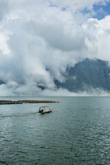 Balinese boat on the lake in the clouds 