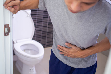 Men have stomach pain and freckles because of urination. A man going to the toilet needs excretion...