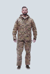 in full growth. a man in autumn camouflage . isolated on white