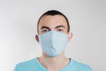 a man in a medical mask from kovid19 blue on a white background