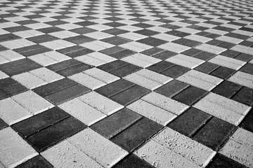 black and white paving stones in perspective shot