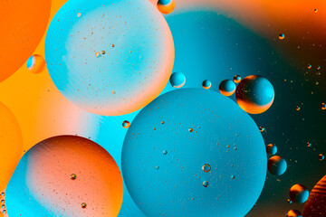 Abstract colorful background with oil on water surface. Oil drops in water abstract psychedelic. Space and universe planets styled psychedelic abstract image