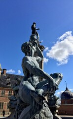 Denmark Statue Frederiksborg Slot with blue sky, Hillerod, Denmark