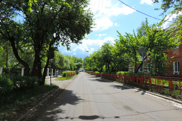 Fototapeta na wymiar deserted provincial town street , carriageway 