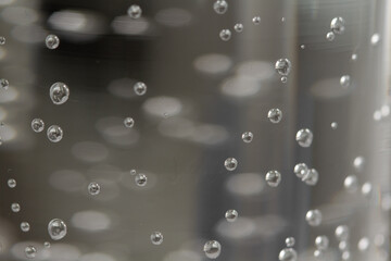 
bubbles in a glass with cold sparkling water