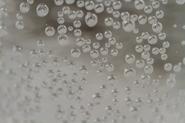 
bubbles in a glass with cold sparkling water
