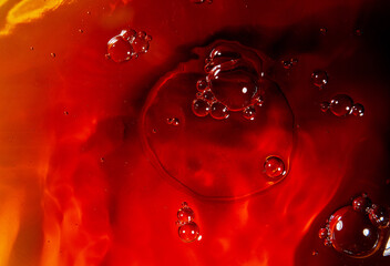 red liquid. Mixing colors in the water