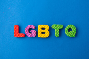 colored letters with word LGBTQ on blue background