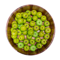 Green apples in a wooden barrel isolated on white background. Top view