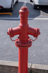 red metal fire hose on the street