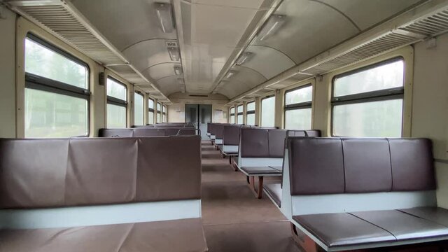 Ride on a suburban electric train in an empty car, review the car and views from the window. 4K shooting