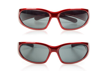 Two separate red glasses on a white background