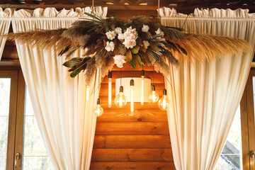 Wedding decor in hall with floral arrangement