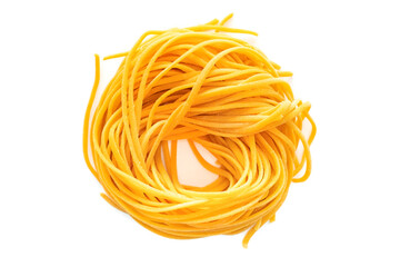 Fresh colored spaghetti pasta with carrots rolled in a nest isolated on a white background