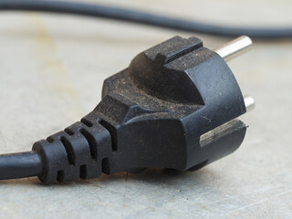 the electric plug was black and dirty on the metal table