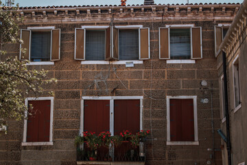 colorful traditional italian house on a sunny day on Burano streets. High quality photo