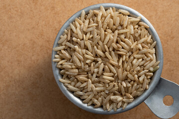 Uncooked Brown Rice in a Measuring Cup