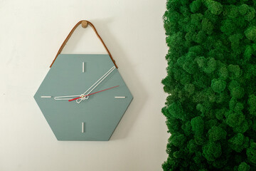 A watch from a tree. It is made hands. Ideas for design and interior. House accessory. Hours of an unusual form