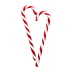 Christmas candy canes isolated on white background. Heart shape made of peppermint candies
