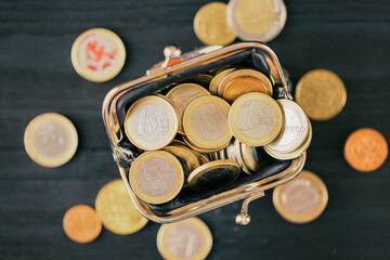 Euro coins in a wallet, top view. concept of small money, the financial crisis, the consequences of quarantine Covid-19