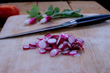 fresh radishes on a wooden table. the first harvest. early summer.