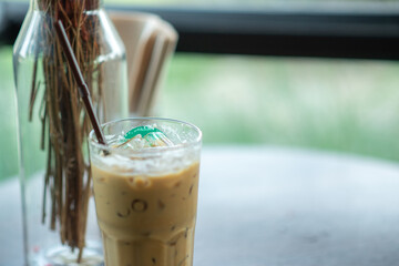 Iced coffee resting on the table background blurred