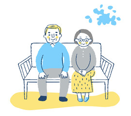 ベンチに座る老夫婦