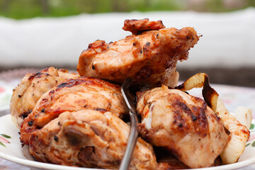 Golden fried chicken thighs. food on the grill