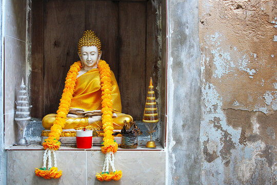The white meditating Buddha statue