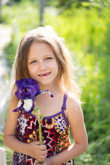 Girl with an iris flower