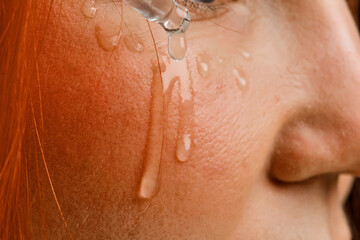 close beauty portrait of a red-haired girl who cleanses the skin with an acidic organic peeling. Isolated on a white background.