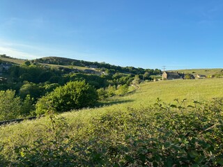 Rural scene with meadows and farm buildings in, Thornton, Yorkshire, UK