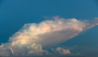 Nature blue sky  background - lightnings in sunset sky with dark clouds and rain